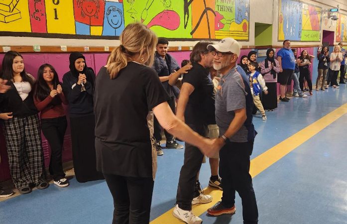  A photo of Ms. Walker and Mr. Lapanowski hugging. 